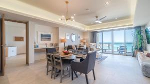 a dining room and living room with a table and chairs at Elegant Ocean Getaway Designed for Relaxation and Luxury in Puerto Peñasco