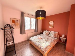 a small bedroom with a bed and a window at Le Robespierre - Parking privé - 5min gare in Reims