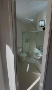 a bathroom with a toilet and a sink at Mirante Pai Inácio in Lençóis +24 photos
