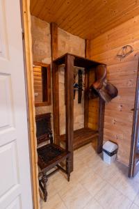 an inside view of a room in a wooden cabin at István Pince a penzión in Šahy