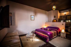 Postel nebo postele na pokoji v ubytování Ryad de Vignes " Le Val d'Argan "