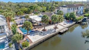 an aerial view of a river with houses and palm trees at Siesta SunDaze - 5430 in Sarasota