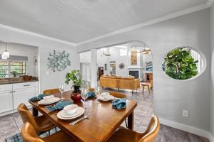 a dining room and living room with a table and chairs at Siesta SunDaze - 5430 in Sarasota