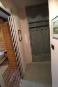 a door leading into a room with a closet at Apartment 'Il Capriolo by Interhome in Sauze d'Oulx