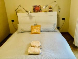 a bedroom with a bed with a bag on it at Isola Blu Milano in Milan