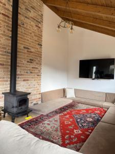 a living room with a couch and a fireplace at צימר בטבע in Majdal Shams
