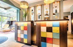 a colorful exhibit in the lobby of a store at Leonardo Boutique Hotel Berlin City South in Berlin