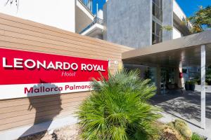 a building with a sign for a marquez royal hotel at Leonardo Royal Hotel Mallorca Palmanova Bay in Palmanova