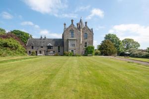 an old castle with a large grass field at 4 Bed in Cardross oc-t30303 in Cardross +17 photos