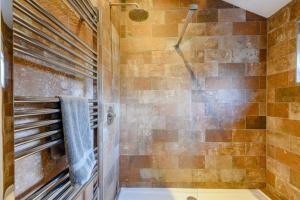 a bathroom with a shower and a tub at 3 Bed in Brancaster oc-h27159 in Brancaster +14 photos