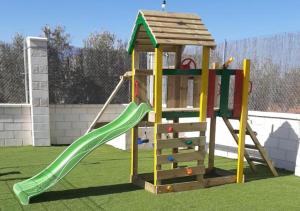 a playground with a slide and a play structure at Casa Rural Kentia in Valdepeñas