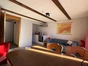 a living room with a couch and a table at Alte Bock 2.0 in Grächen
