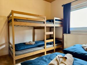 a bunk bed room with two bunk beds at Wellness chata Kozička in Klokočov +42 photos