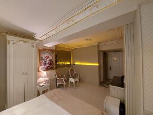 a bedroom with a bed and a table and chairs at Leyenda Boutıque Hotel in Istanbul