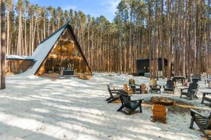 a cabin in the woods in the snow at The Dream House Retreat in Necedah