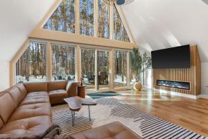 a large living room with a couch and a fireplace at The Dream House Retreat in Necedah