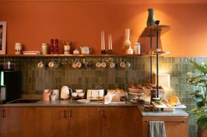 a kitchen with a counter with pots and pans at Jan Luyken Amsterdam in Amsterdam