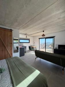 a bedroom with a bed and a view of the ocean at Casa Bela in Villaverde