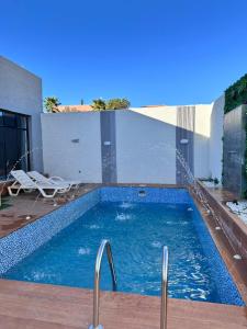 a swimming pool in the middle of a building at شاليهات سمو بارك 2 in Taif