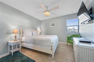 a bedroom with a bed and a ceiling fan at Sea Breeze 316 by Vacation Homes Collection in Gulf Shores