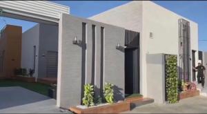 a rendering of a house with a person walking outside at شاليهات سمو بارك 2 in Taif