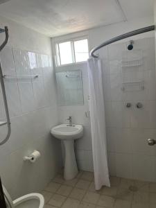 a bathroom with a sink and a toilet and a shower at CASA DE LA ABUELa in Colima +16 photos