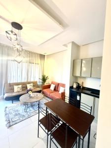 a living room with a table and a couch at شاليهات سمو بارك 2 in Taif