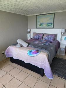 a bedroom with a large bed in a room at Unit 9 The Beachfront in Ramsgate +11 photos
