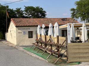 a group of umbrellas sitting outside of a building at Hostal la Colmena in Ávila
