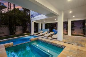 a swimming pool in a house at LUXURY VACATION HOME! ADD A GOLF CART!! in Bradenton Beach