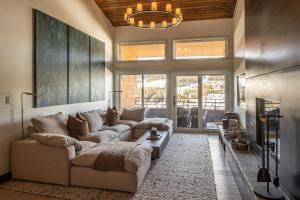a living room with a couch and a table at North Summit in Big Sky