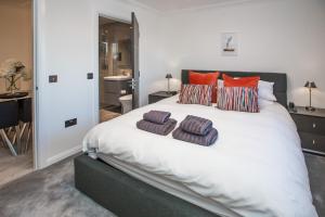 a bedroom with a large bed with two pillows on it at Lewis Living in Isle of Lewis