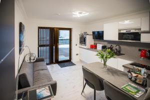 a living room with a couch and a table at Lewis Living in Isle of Lewis