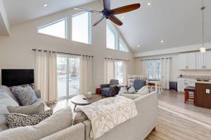 a living room with a couch and a ceiling fan at Schroon Lake Retreat in Schroon Lake