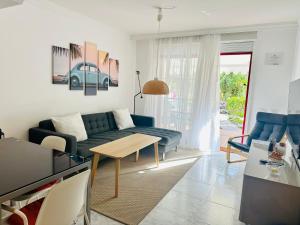 a living room with a couch and a table at Casa Heidi by Marena Homes in Playa del Cura