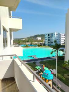 a view of the pool from the balcony of a apartment at Apartment with lagoon view mas amenities in Mazatlán