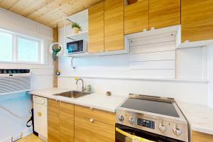a small kitchen with a stove and a sink at Sun Mark 253 in Ocean City