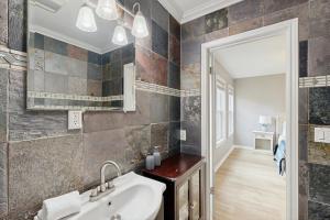 a bathroom with a sink and a mirror at The Lazy Oak Retreat in Rockport +11 photos