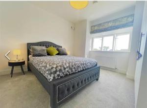 a bedroom with a bed and a window at Manor Brook House in Adare
