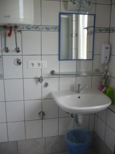 a bathroom with a sink and a mirror at House Dragica in Cres