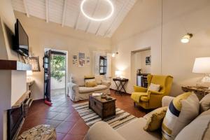 a living room with a couch and a table at Family & Friends Retreat w/ Pool - Moncarapacho in Tavira +44 photos