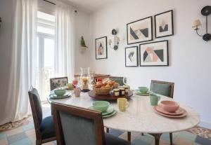 a dining room table with a bowl of food on it at SOLO ! Charme Boutique in Avis