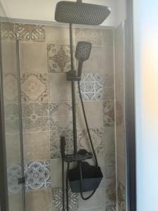 a shower with a floor lamp in a bathroom at Apartamento Deluxe II RB in Ribeira Brava +21 photos