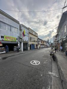 a street with a no parking sign on the road at Hotel Royal Suite in Manizales