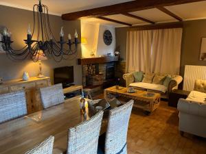 a living room with a couch and a table at Balcons de la semois in Vresse-sur-Semois
