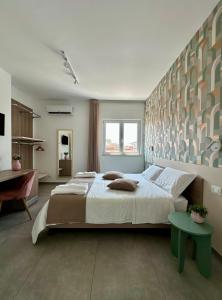 Vuode tai vuoteita majoituspaikassa B&B Raphaël