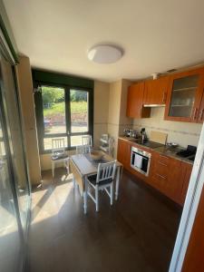 a kitchen with a table and chairs in a room at Casa Socias in Camoca +9 photos