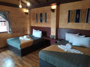 a room with two beds and a couch in it at Hotel & Cabañas Malinche in Huamantla +79 photos