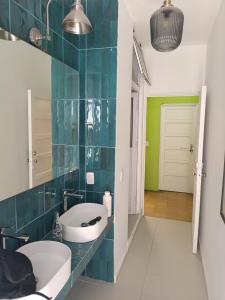 a bathroom with a sink and a mirror at Hotel del Angel in Guadalajara +32 photos