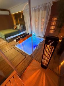 a view of a room with a bed and a swimming pool at Ama Esclusive Spa Firenze in Florence